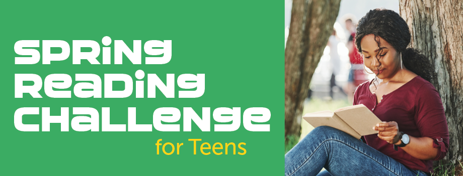 teen girl sitting by a tree reading a book