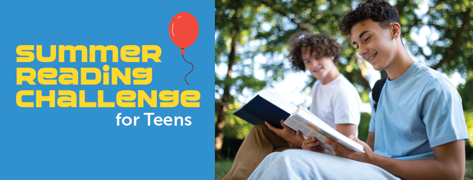 two smiling teen boys reading books outdoors