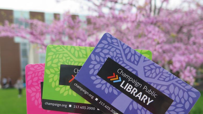 colorful library card, library in background